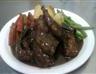 Our signature dish....Fried in garlic and simmered in wine !
